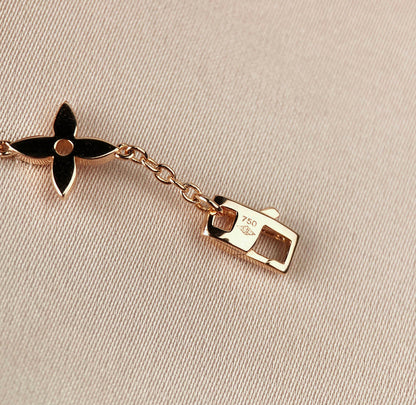[Everoly JW] GOLDARMBAND MIT 7 MOTIVEN UND STERN