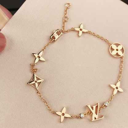 [Everoly JW] GOLDARMBAND MIT 7 MOTIVEN UND STERN