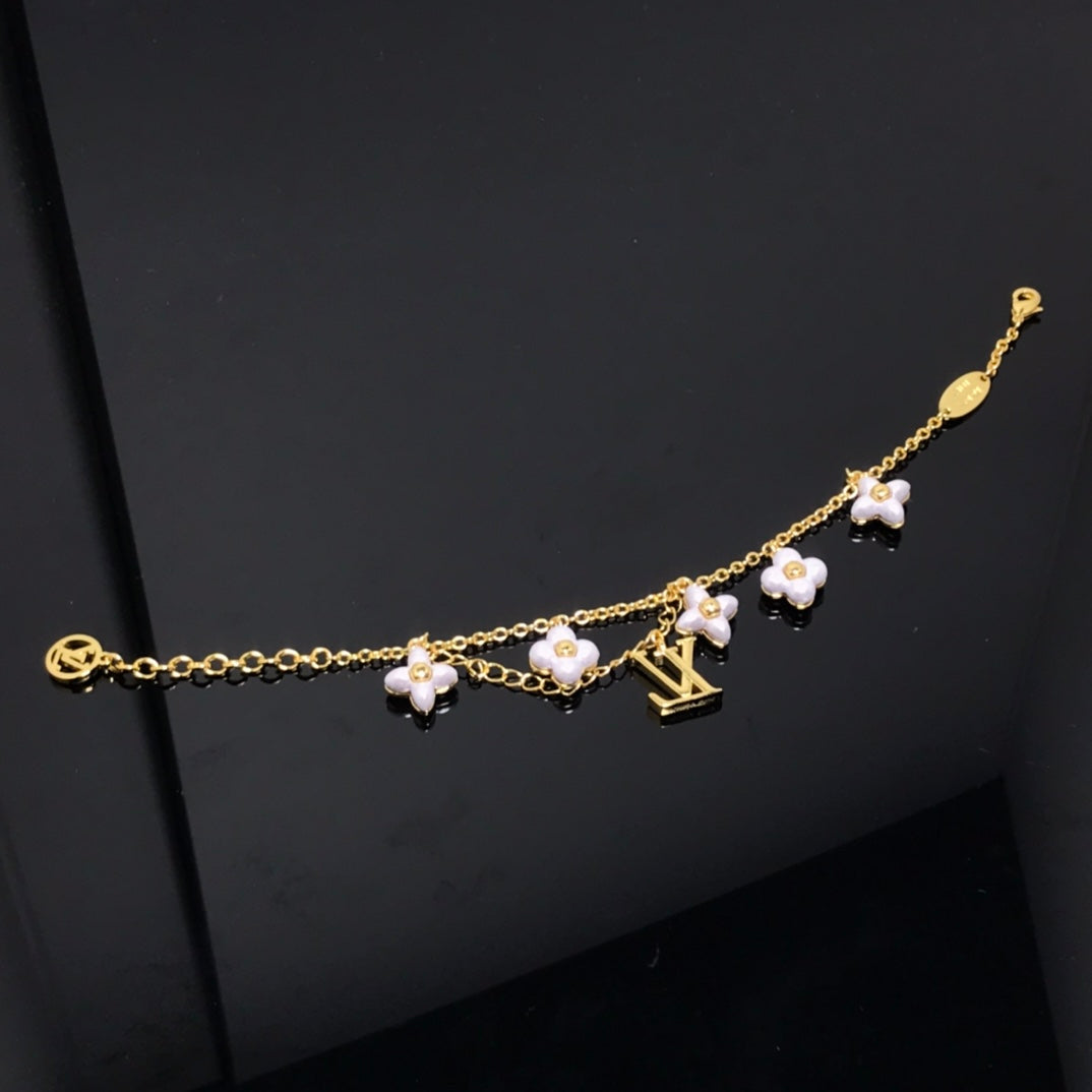 [Everoly JW]LOGO 6 MOTIF STAR AND SUN GOLD BRACELET